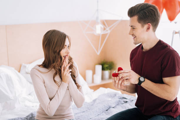 istock Surprised young woman covering her mouth 1002656090