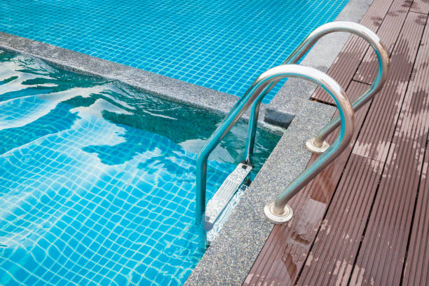 istock Stairs of the empty swimming pool. 1002656858