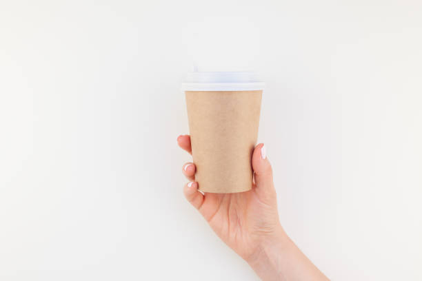 istock Mock up of coffee cup in female hand 1002663106