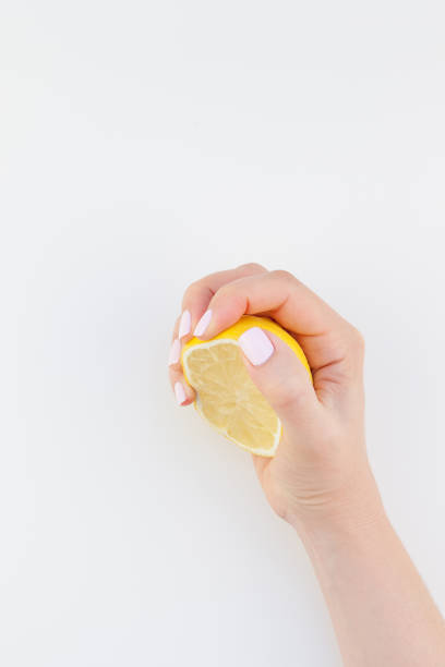 istock Woman hand with lemon 1002663226