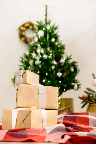 istock Beautiful Christmas interior design. Selective focus on gifts, o 1002663376
