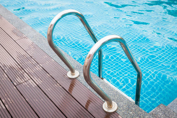 istock Stairs of the empty swimming pool. 1002663388