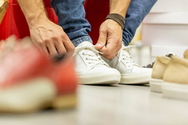 istock Tying shoelaces on sneakers 1002664048