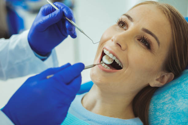 istock Close up of male hands that checking teeth 1002671556