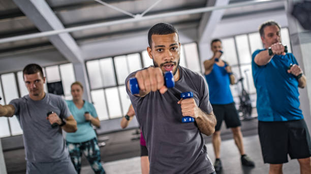 istock People exercising in gym 1002674212