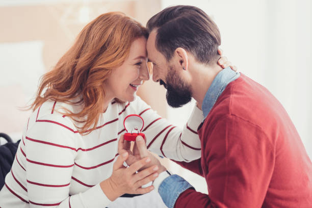 istock Emotional woman feeling happy after her beloved man making a proposal 1002674950