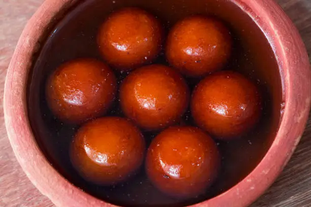 Indian Sweet Gulabjamun is a sweet Bangali syruph Dessert