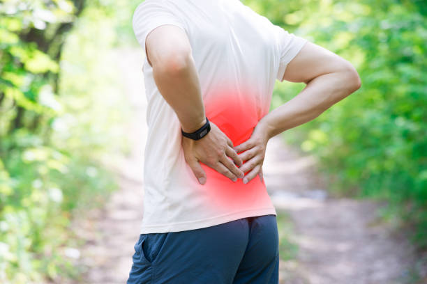 istock Man with back pain, injury while running, trauma during workout 1002678376