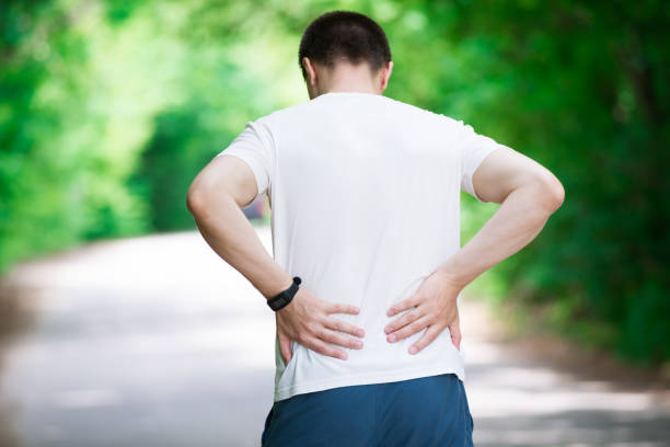 istock Man with back pain, kidney inflammation, trauma during workout 1002680568