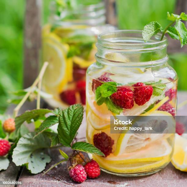 Fresh Cold Lemonade In The Garden Stock Photo - Download Image Now - Infused Water, Backgrounds, Berry Fruit