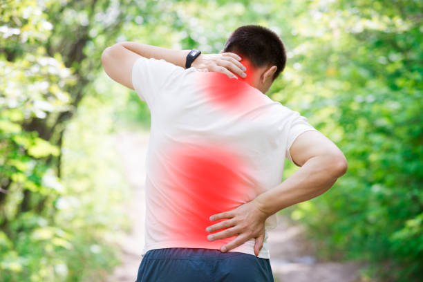 istock Man with back pain, injury while running, trauma during workout 1002680892
