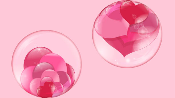 istock hearts lie inside a transparent glass bowl and a bubble flies with hearts inside on a pink background 1002687862