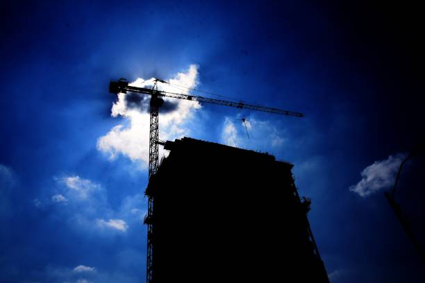 istock Looking up on the construction of a residential tower 1002689618