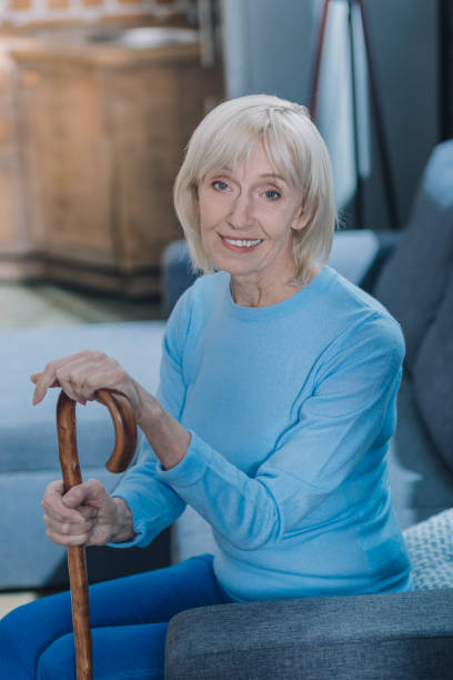 istock Alert woman holding a stick 1002693412