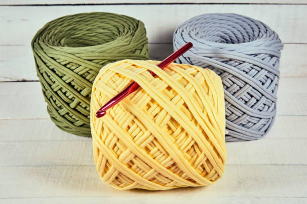 istock reel of colored knitted yarn 1002695892
