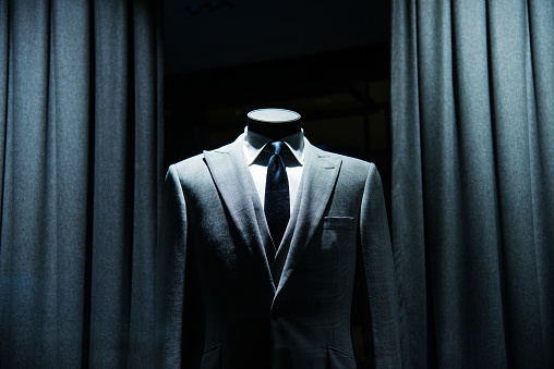 business suit store window display.
