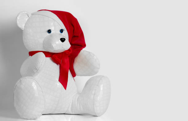 istock beautiful toy bear wishes Merry Christmas 1002718254