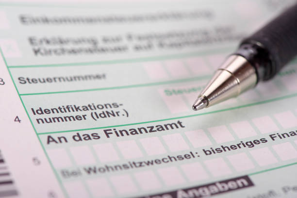 Make filling in German tax form German tax form for tax office - in German language: Finanzamt german language photos stock pictures, royalty-free photos & images