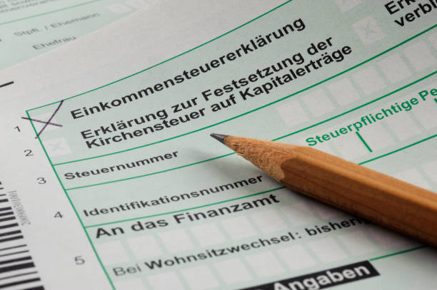 Make filling in German tax form stock photo