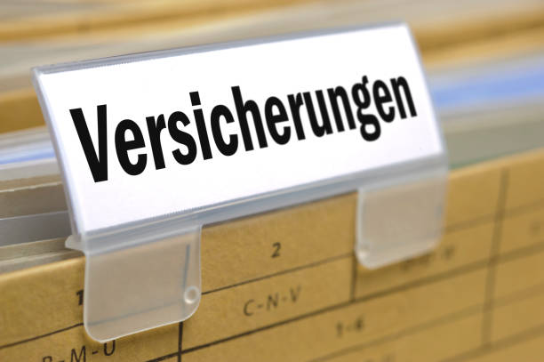 file folder in office printed with insurance - in German language: Versicherungen