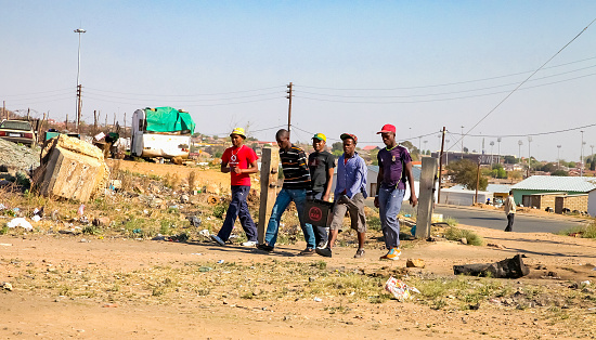 Johannesburg, South Africa, September 11, 2011, Young African Men walking in urban Soweto South Africa