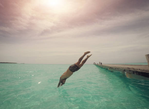 istock Man diving in to the sea 1002732518