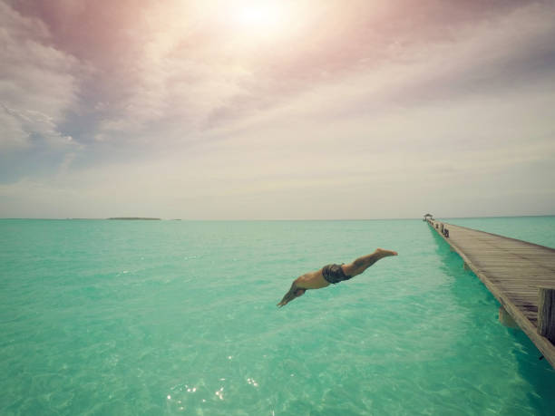 istock Man diving into the sea 1002732794