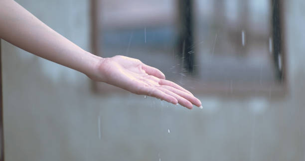 istock woman watching rain at cafe. 1002737682