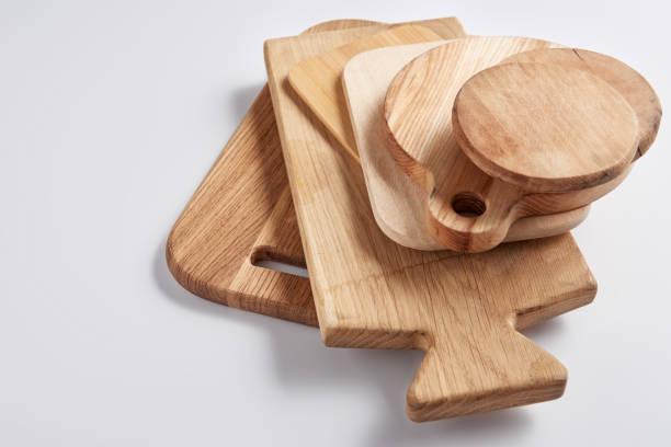 istock close up image of stack of different wooden cutting boards on white table 1002740792
