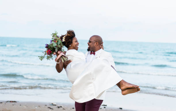 African American couple getting married at the beach African American couple getting married at the beach mature couple photos stock pictures, royalty-free photos & images