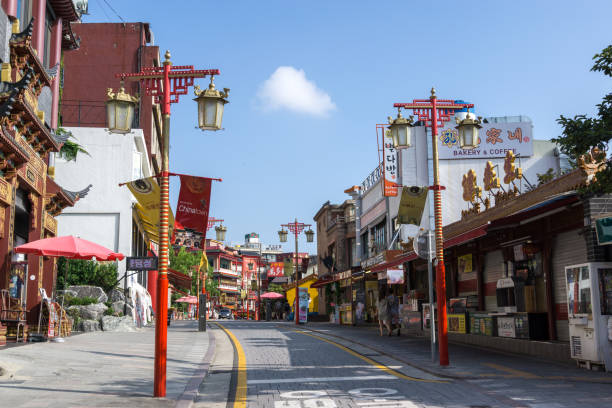 Incheon chinatown restaurants Incheon chinatown restaurants and shops along the street  taken during summer afternoon. It is in Jung-gu district of incheon in south korea. Taken on July 18th 2018. incheon stock pictures, royalty-free photos & images