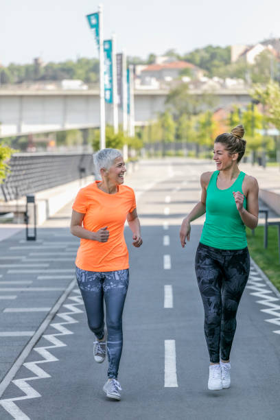 istock Young and senior sportswoman running 1002749422