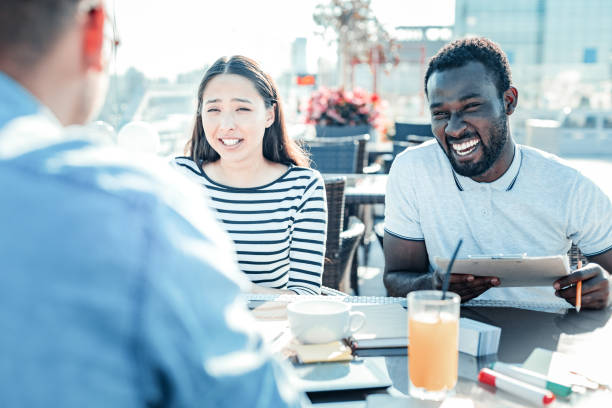 istock Joyful bearded man laughing at joke 1002749506