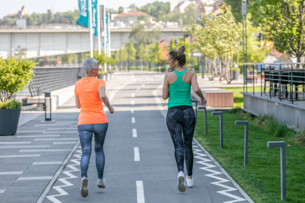 istock Young and senior sportswoman running 1002749570