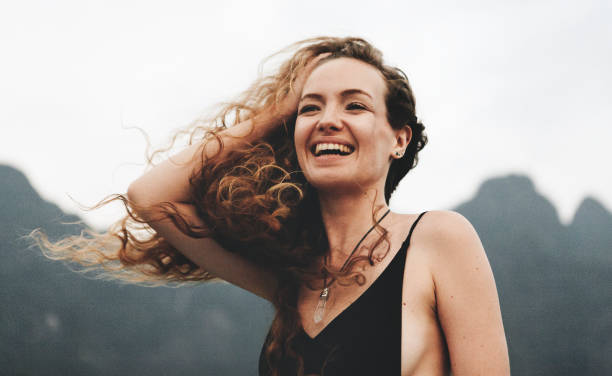 istock Blond woman enjoying the summer breeze 1002749598