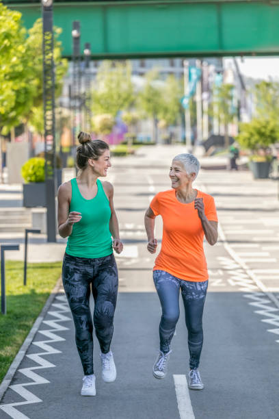 istock Young and senior sportswoman running 1002750146