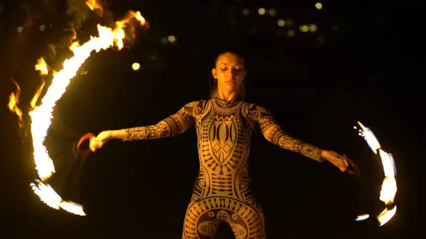 Photo of Female Fire Acrobat at Night