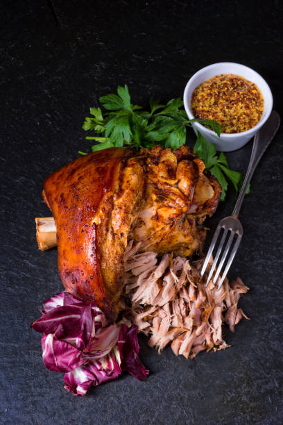 istock fresh roasted knuckle of pork with mustard 1002753118