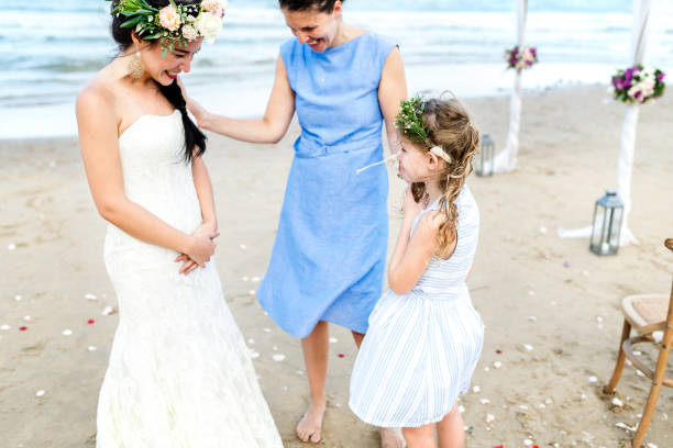 istock Cheerful bride at the beach 1002753566