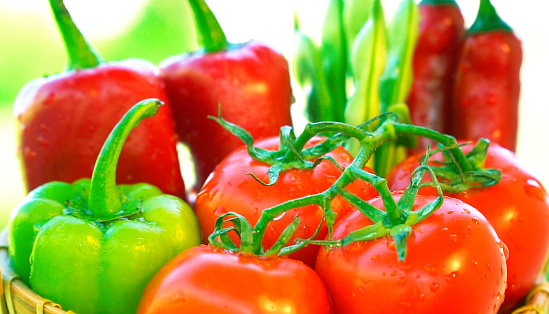 Small cherry tomatoes on the whole screen. Small red cherry tomatoes. Cherry tomatoes close-up on the whole screen. Macro photo of red cherry tomatoes in close-up.