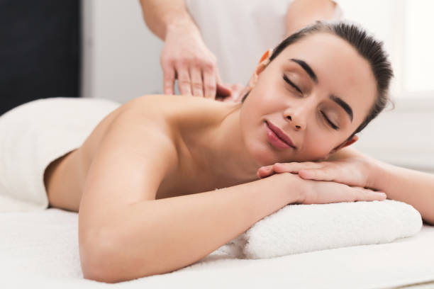istock Woman getting classical back and neck massage 1002756412
