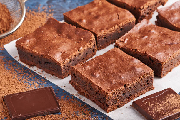 istock homemade chocolate brownies on dark blue background 1002757238