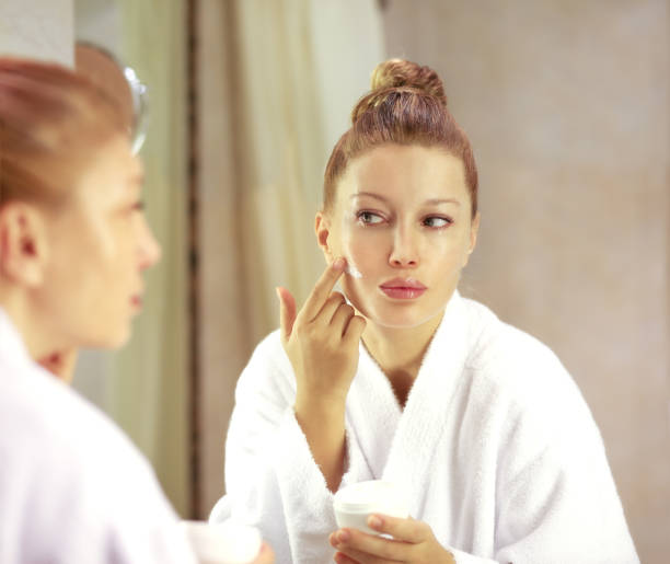 istock Magic anti-aging cream.Applying the cream 1002762812