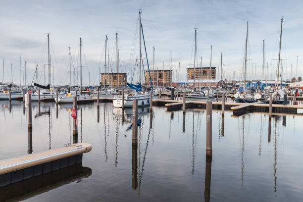 istock Muiderzand marina. Sailing yachts in evening 1002764274