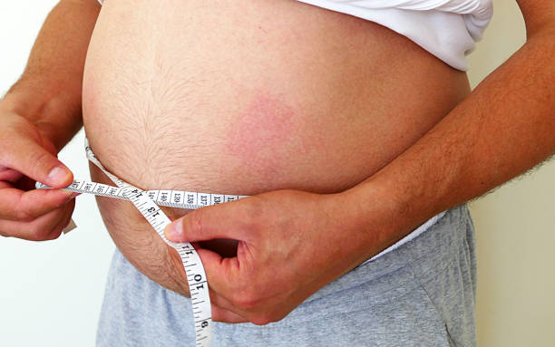 istock bellied men complain of a human weight, 1002771364
