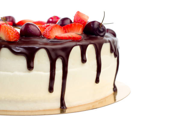 istock delicious cake with cherries strawberries and chocolate cream 1002773604