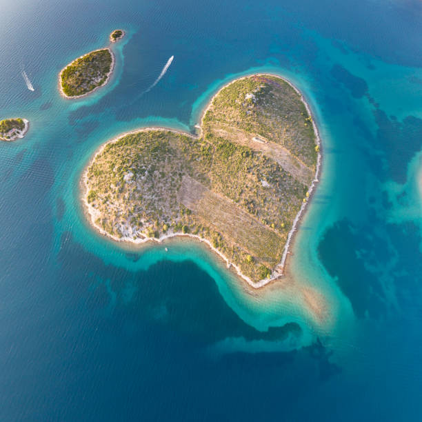 Galešnjak, Heart Love Island, Croatia Aerial of the heart shaped Island Galešnjak. Located in the Pašman Canal of the Adriatic, between the islands of Pašman and the town of Turanj on mainland Croatia. Converted from RAW. adriatic sea photos stock pictures, royalty-free photos & images