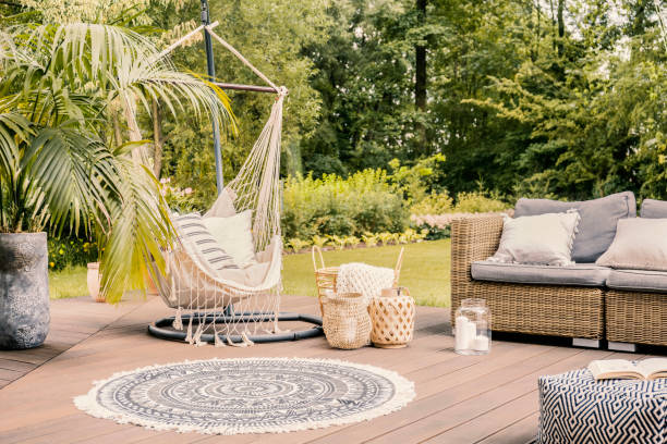 Pillows on hammock on terrace with round rug and rattan sofa in the garden. Real photo Pillows on hammock on terrace with round rug and rattan sofa in the garden. Real photo hostel photos stock pictures, royalty-free photos & images