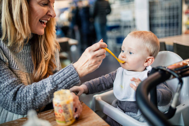 Feeding Her Baby Grandson