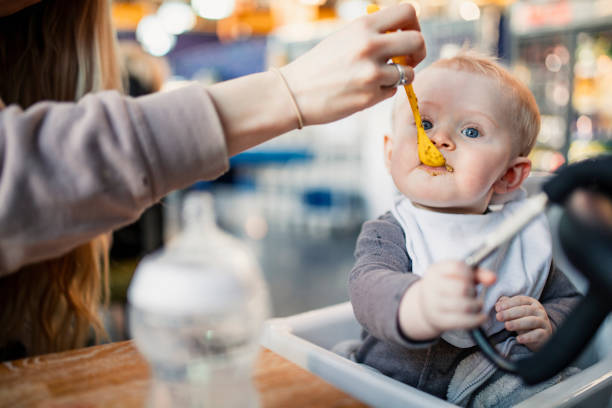 istock Feeding The Baby Boy 1002778432